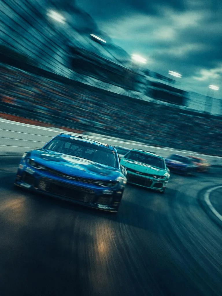 NASCAR stock cars racing in motion blur